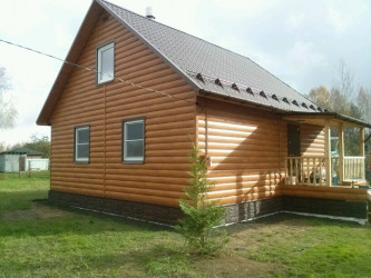Дом из бруса с внешней отделкой фасада блок-хаусом