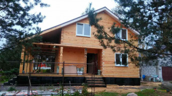 Дом из бруса с мансардой и террасой